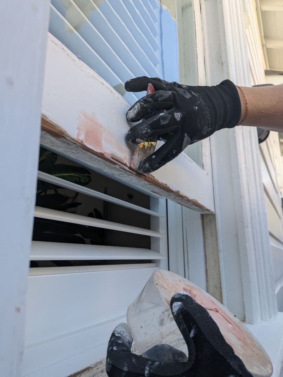 Hand-painting an exterior window sill